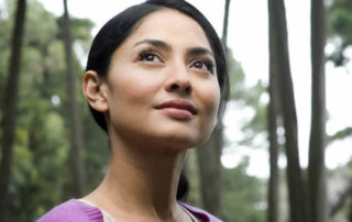 A content young woman looking into the sky.