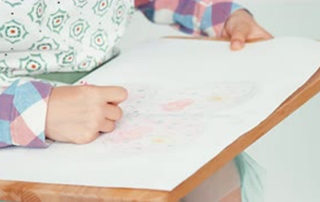Child drawing and being creative