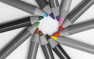 Colourful pencils in a circular formation.