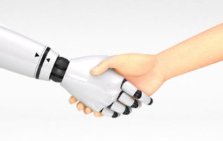 Person shaking hands with a robot