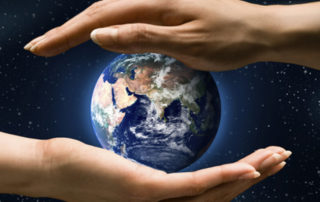 A graphic design illustration of two hands holding the earth.